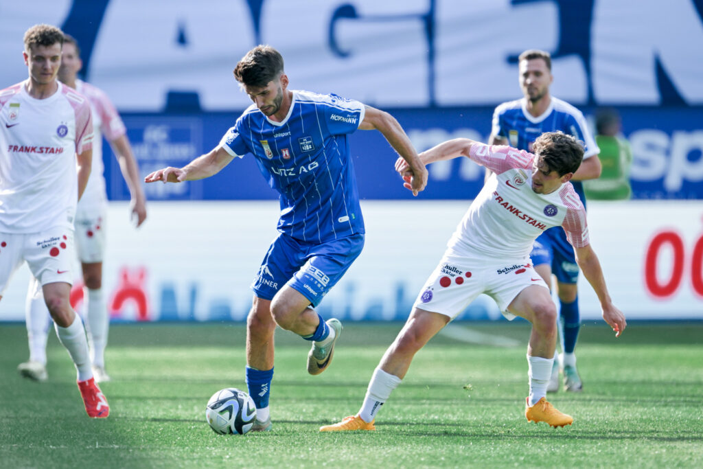 LINZ,AUSTRIA,18.MAY.24 - SOCCER - ADMIRAL Bundesliga, qualification group, FC Blau Weiss Linz vs FK Austria Wien. Image shows Alem Pasic (Linz) and Dominik Fitz (A.Wien). Photo: GEPA pictures/ Christian Moser